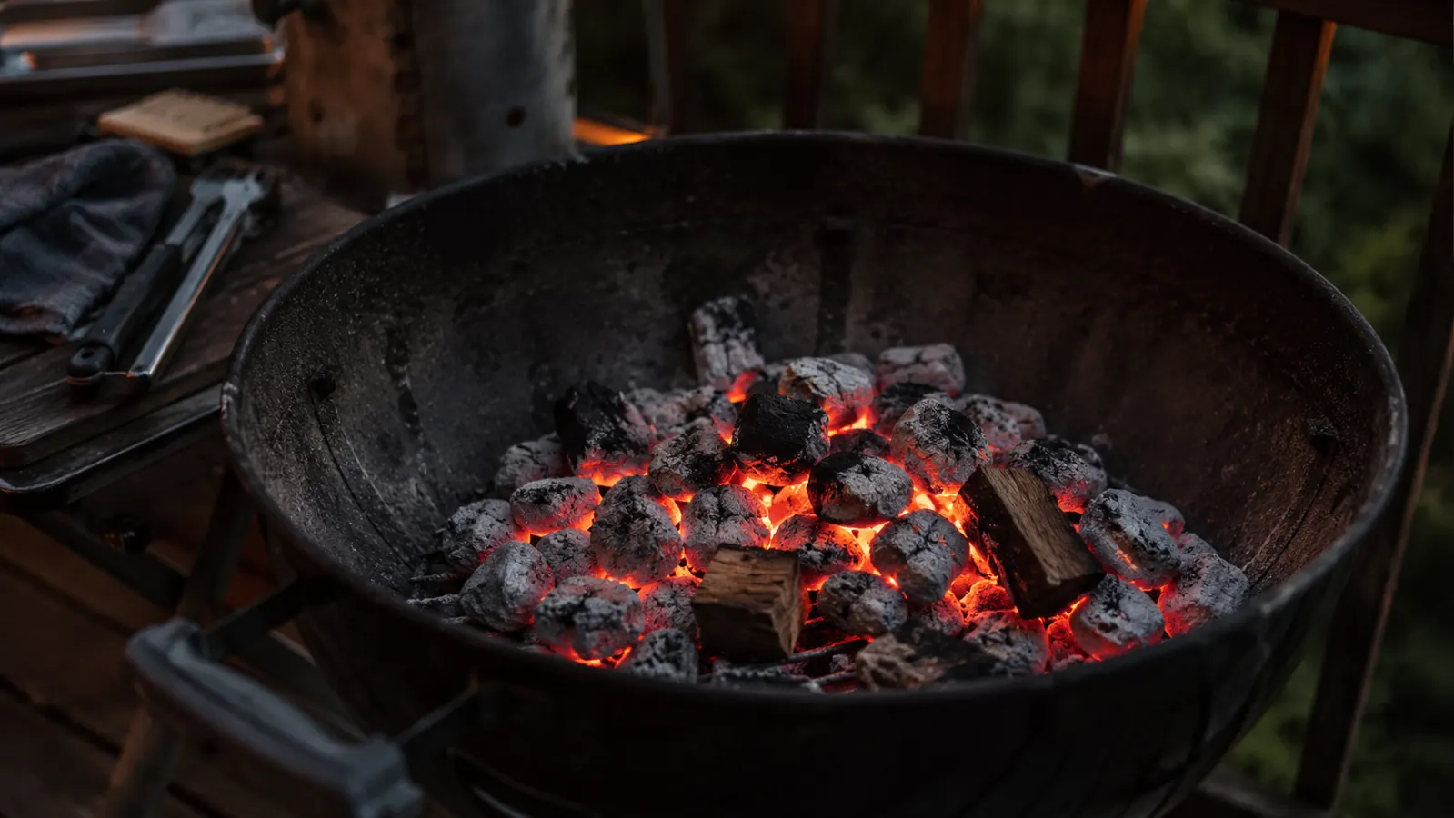 Even spread of glowing coals on a charcoal grate just before cooking